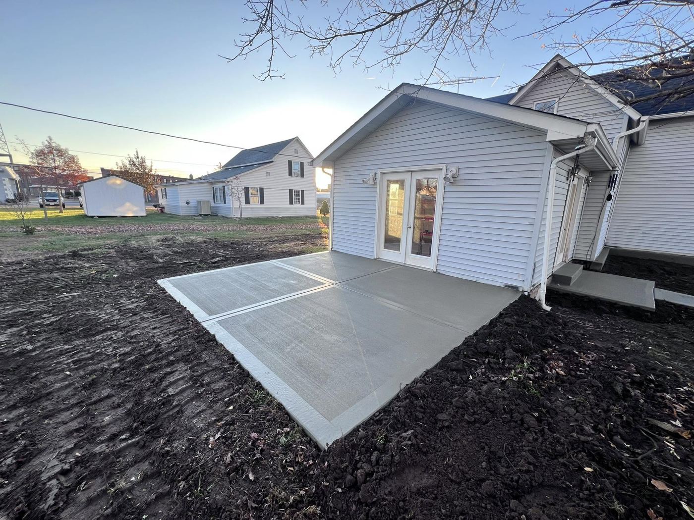 Home addition with French doors, vinyl siding and a new concrete patio