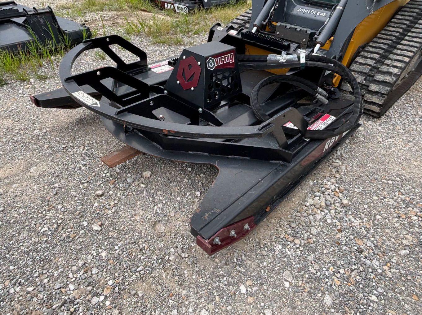 Brush hog attachment on a John Deere track loader